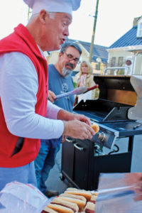 Bob Ball and Mark Metzger served complimentary hotdogs for all in attendance.