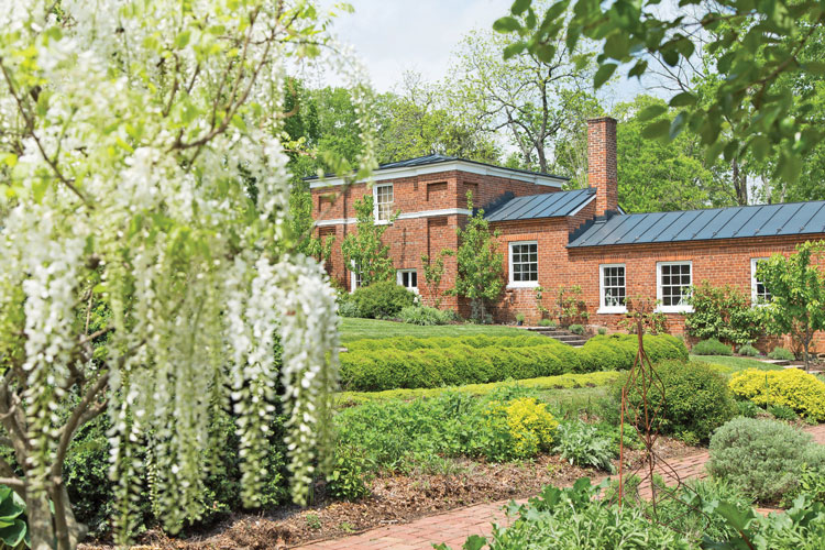 The brick building in the garden is called the garden dependency. It is believed to have been used by slaves as a kitchen and laundry.