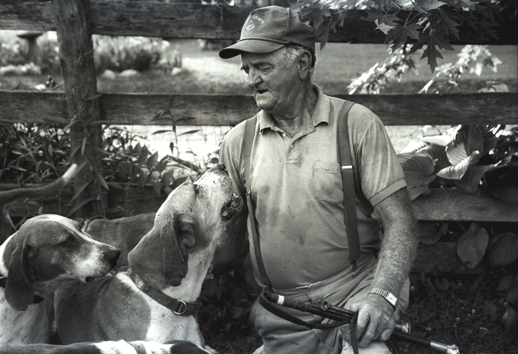 Iconic black and white image of Melvin Poe with his hounds. Courtesy photo by Janet Hitchen