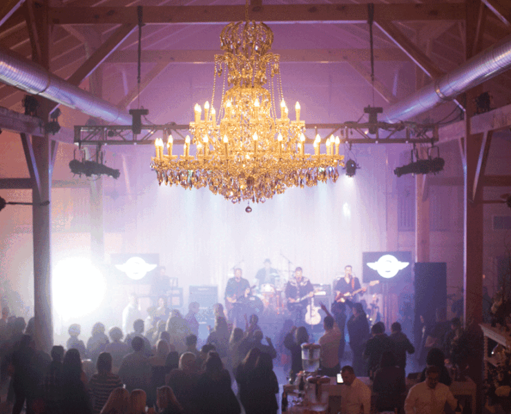 The expansive dance floor easily accommodated the eager guests thoroughly enjoying the band. Photo courtesy of Klaire Dixius Photography