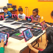 Students participating in a binary coding exercise at INMED’s Opportunity Center in Sterling