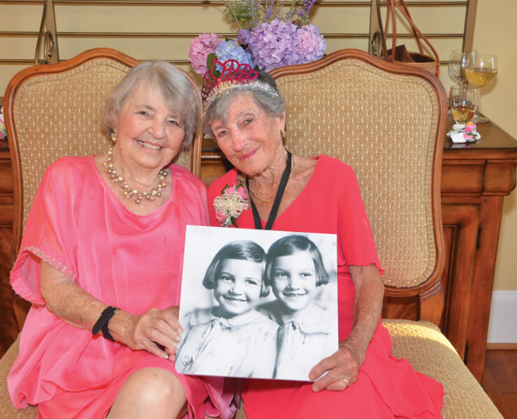 Ann MacLeod and her late sister, Kit, were so close in age that people thought they were twins. To commemorate dressing alike growing up, the pair wore similar outfits for the 95th Birthday Bash that Beth Ann Mascatello threw for Ann in 2017. Kit passed away later that year. Photo by Nancy Milburn Kleck Photography.